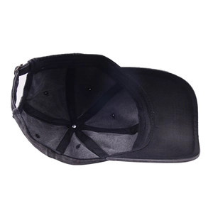 Washed dark gray baseball cap with adjustable metal buckle shown from top-down interior view