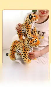 Asian model holding leopard plush toys showing 27cm and 35cm size comparison