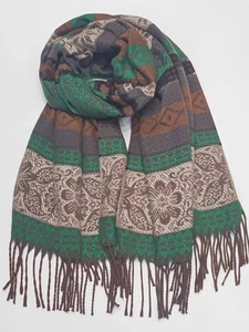 Detail view of woven cashmere-like scarf showing vintage floral patterns and fringe edges