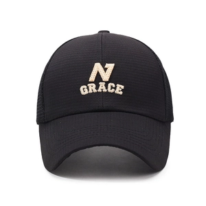 Men's breathable mesh trucker hat in black with N GRACE embroidery and curved brim