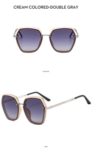 Detail view of cream colored metal sunglasses with gradient lenses in two angles