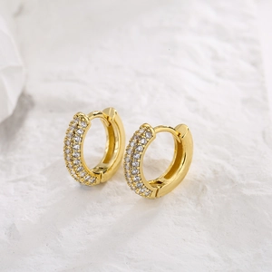 Detail of 18K gold plated hoop earrings with micro-paved cubic zirconia stones