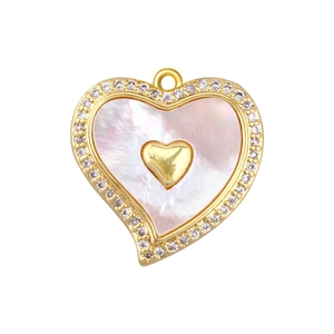 Detail of a heart-shaped gold pendant with pink shell inlay and sparkling zirconia border