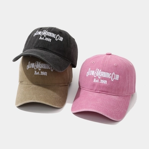 Washed cotton baseball caps with Slow Morning Club embroidery in black, khaki, and pink