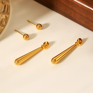 Detailed view of 18K gold plated bead studs and water drop dangle earrings set