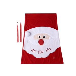 Large red velvet Santa candy bag with HO HO HO pattern and decorative polka dot ribbon
