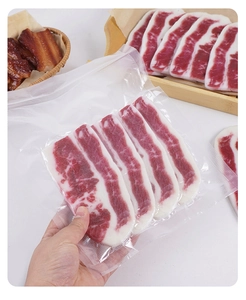 Detail view of artificial snowflake beef slice model in clear vacuum sealed packaging