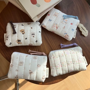 Quilted cotton animal mini coin purses with colorful zippers and textured fabric