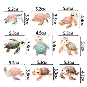 Detailed size chart of nine cartoon sea turtle cake toppers on a white background