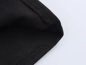 Detailed close-up showing the high-quality stitching and texture of black vest suit pants