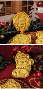 Detail of Christmas cat cookie cutters showing wreath and stocking kitten shapes