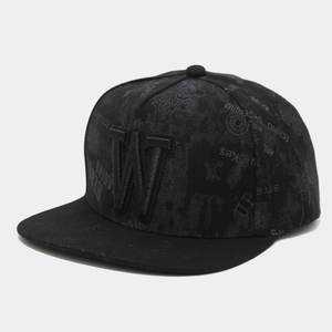 Close-up of 3D letter W embroidery on black flat brim hip hop cap with letter patterns