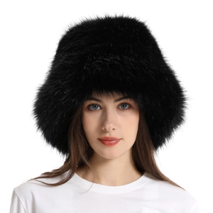 Detailed texture of thick black faux fur on winter bucket hat worn by model