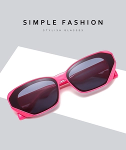 Detail of pink rectangular cat-eye sunglasses on a modern geometric background