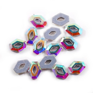 Macro shot of AB colored hexagon crystals with iridescent coating for DIY nail art