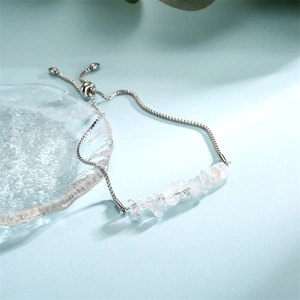 Detail of adjustable stainless steel chain bracelet with natural clear crystal stones