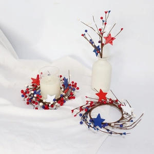 Patriotic July 4th candle ring with red white blue berries and wood stars centerpieces