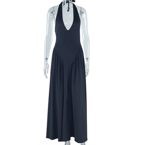Detail of black halter neck maxi dress featuring deep V-neck and slim fit waist design