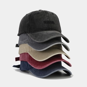 Five assorted colors of vintage washed cotton baseball caps with HELLO embroidery