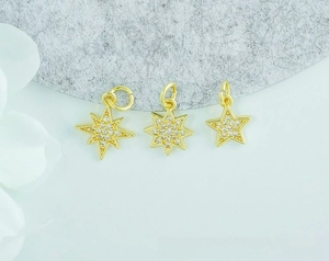 Detail of 18K gold-plated star charms with micro-paved zircons for DIY jewelry