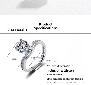 Macro shot of white gold plated ring featuring pear-cut zircon and pave twist band detail