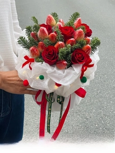 Detail of Christmas strawberry bouquet with LED lights and Merry Christmas ribbon decoration