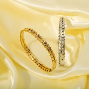 Bracciali a forma di foglia in oro 18K e argento con cristalli su seta gialla
