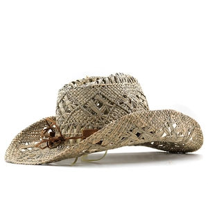 Handwoven natural straw cowboy hat with cutout texture and decorative leather band