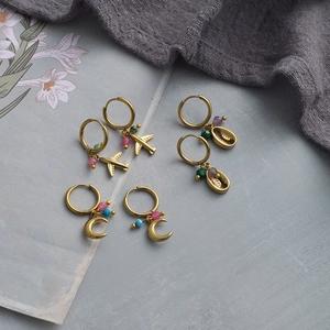 14K gold hoop earrings set with colorful beads, airplane, shell and crescent charms