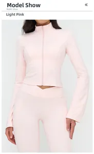 Slim-fit pale pink yoga jacket featuring a stand collar and flared zip cuffs for women