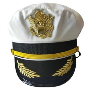Close-up of golden eagle emblem and wheat embroidery on a white captain hat