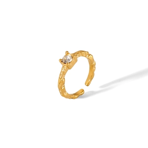 Detailed view of 18K gold plated stainless steel ring with textured band and zircon stone