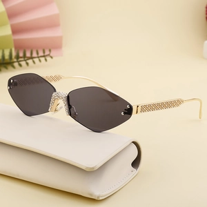 Diamond-cut rimless sunglasses for women with rhinestone inlay and gold metal temples
