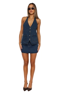 Detailed close-up of dark blue denim vest with metal buttons and classic texture