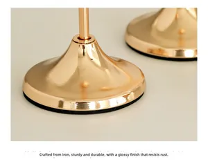 Macro detail of steady golden iron candle holder base with black anti-slip velvet padding