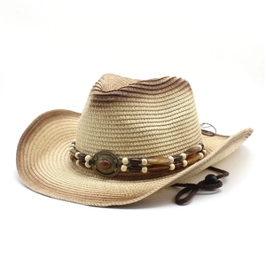 Detail of straw cowboy hat with ethnic beads and adjustable chin strap on white background