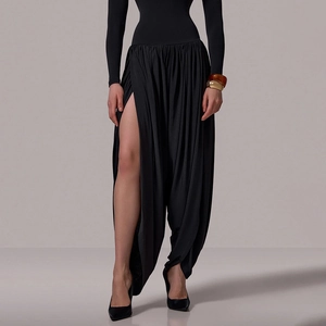 Close-up detail of soft black fabric featuring a stylish side slit on loose long pants