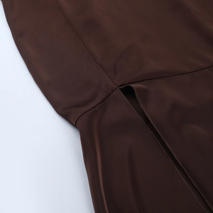 Detail view of the side slit and high-quality seam work on the dark brown satin dress