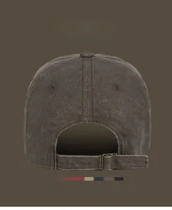 Detail view of the washed cotton baseball cap featuring an adjustable metal back buckle