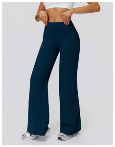 Macro detail of high-waist yoga flared pants showing high-elastic athletic fabric texture