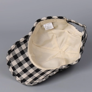 Linen checkered baseball cap with internal tag showing 56-58cm size and material detail