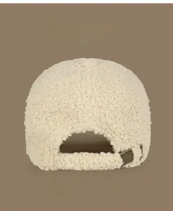 Detail view of beige lamb wool baseball cap back with adjustable metal buckle and strap