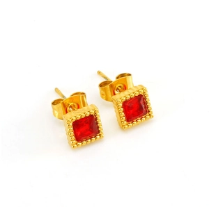 Detail of square gold earrings with red zircon center and decorative beaded metal trim