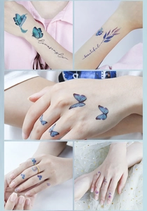 Detailed view of colorful glitter butterfly tattoo stickers and script on skin