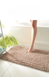 Close-up of thick chenille bath mat in khaki with anti-slip texture and soft fibers