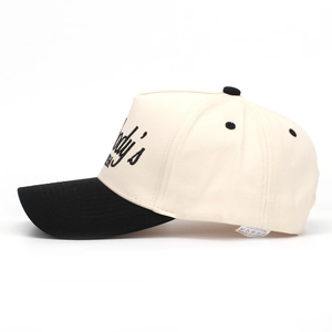 Detail view of cotton baseball cap with side embroidery and contrast color design