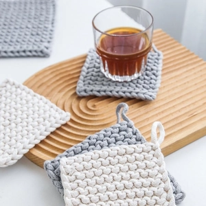 Nordic handwoven cotton pot holder with hanging loop for heat resistant kitchen table use