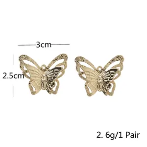 Elegant gold butterfly earrings with hollow mesh wings, pair 3cm width, weight 2.6g