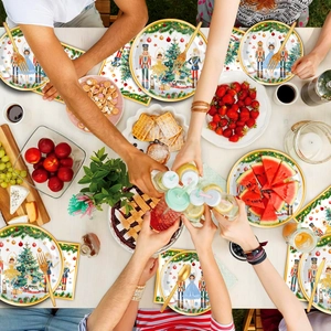 Close-up of Christmas nutcracker party plates and napkins on a festive dining table