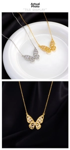 Detailed view of butterfly pendants in gold and silver finish with zircon inlay
